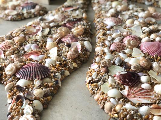 With seashells and sand, after adding epoxy and showing how it looks wet.