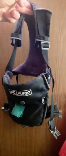 green thing is a poop bag, doesn't come with the harness