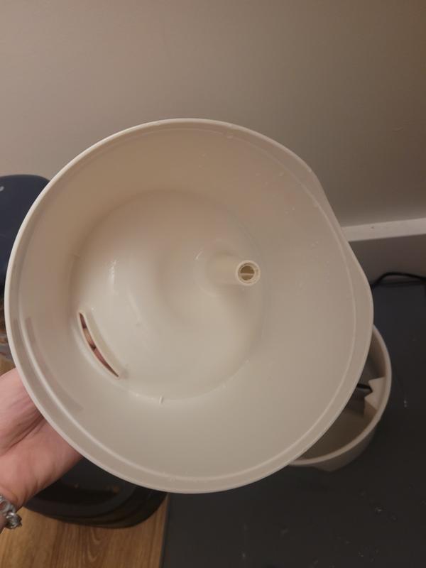 Lid has only the one small hole but is bigger than the base, which can lead to spills when not properly aligned