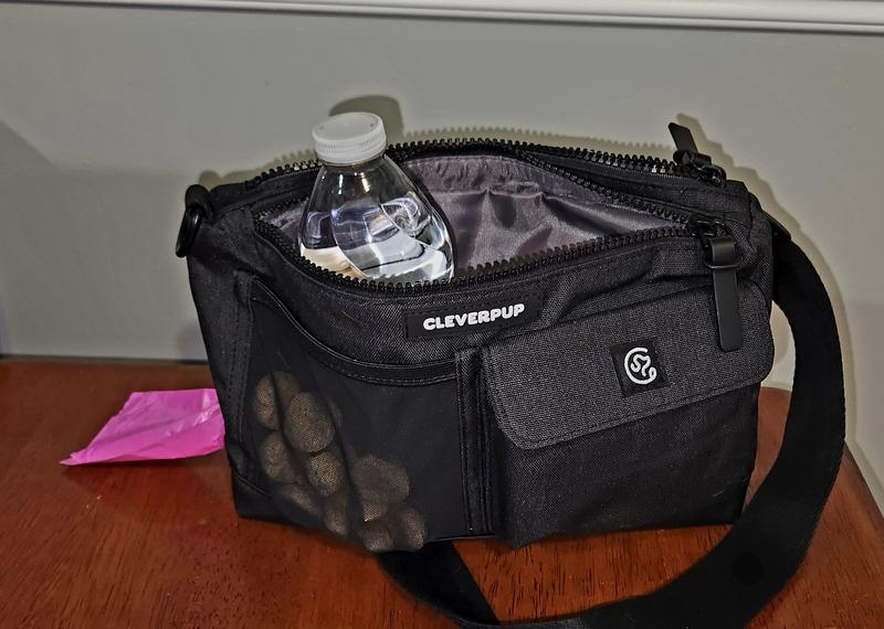 Front of the bag, great for treats or extra baggies. Is super cute and adjustable waist or crossbody strap.