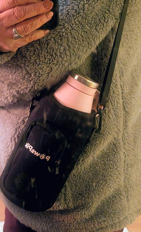 Bottle in the padded insulated sleeve and attached shoulder strap