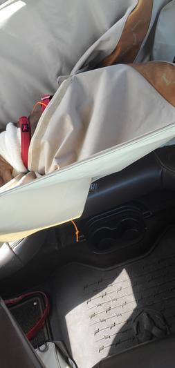 This is my dog twisted into the seat hammock.