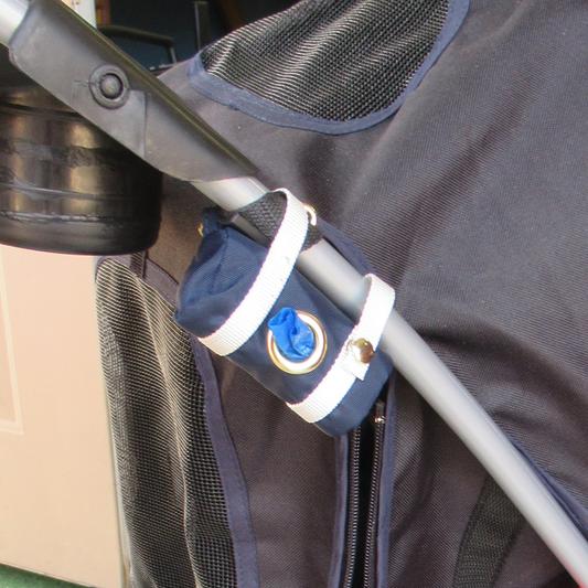 Snapped straps to opposite sides to attach to stroller bar.