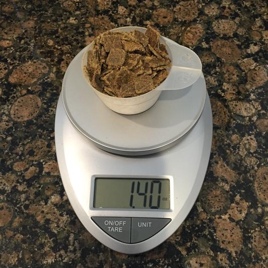 Each scoop should weigh 2oz... Here the scale was zeroed out with the cup.
