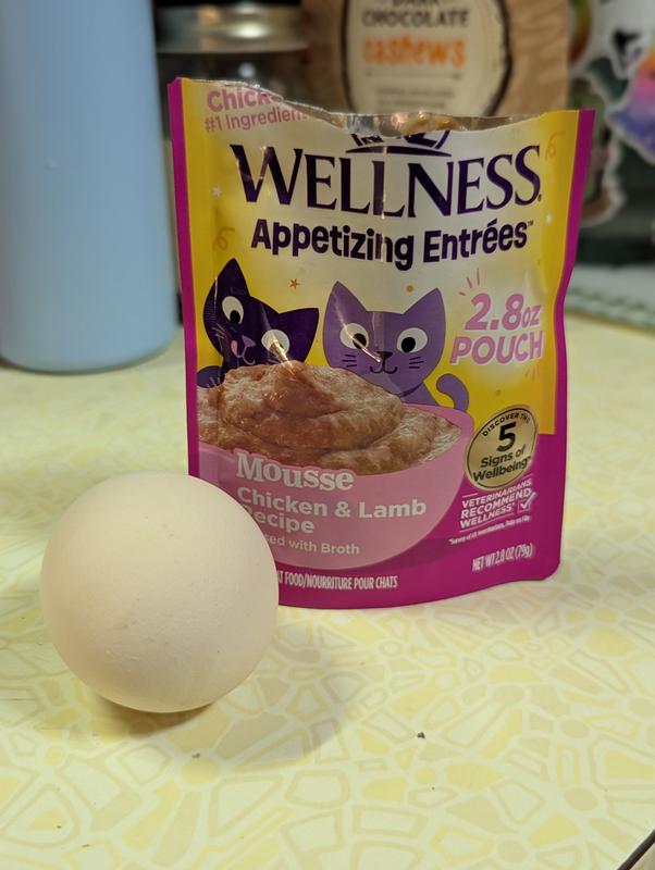 Open pouch with chicken egg for size reference