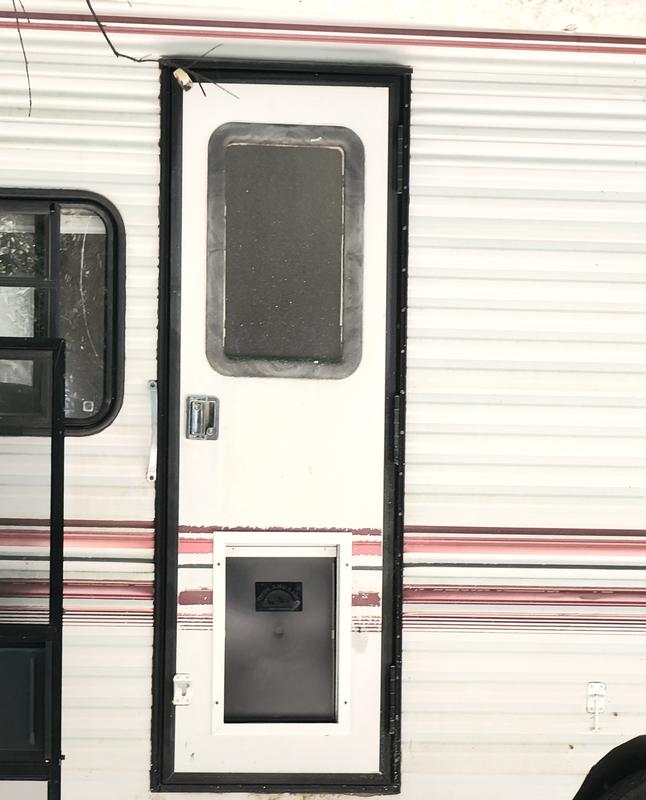 Screen door removed and dog/cat door installed