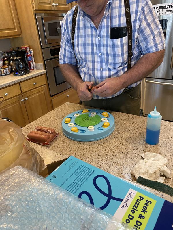 Burt cutting hotdogs