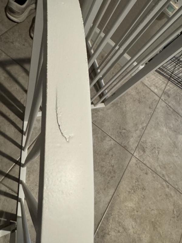 Crack in wood. Covered up with paint.