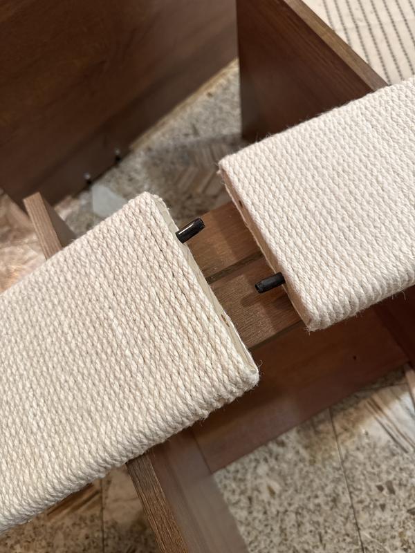 No screw holes attaching the posts, only little metal dowels that come apart.