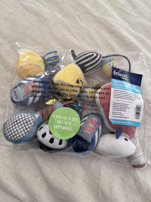 The unopened pack of tennis toys