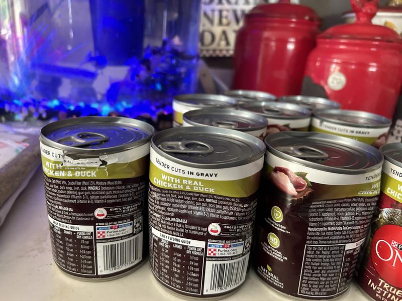 Purina One Bent up cans