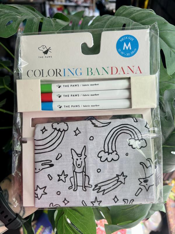 Bandana in the product box.  The outside features a print of dogs, rainbows, shooting stars, and confetti.  It is meant to be coloured in with the included markers.