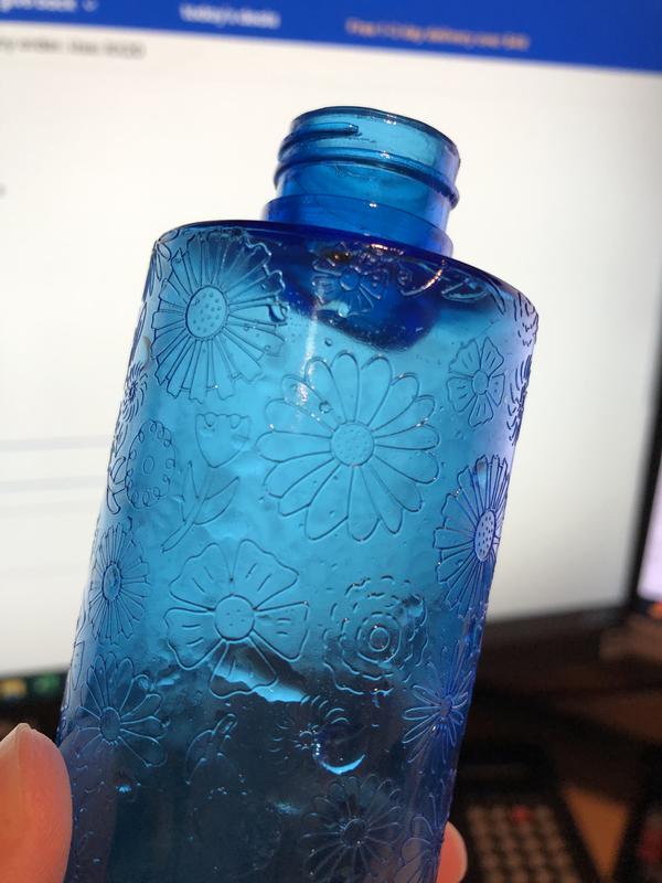 Bottle neck extends into bottle, creates air pocket, causes leaking
