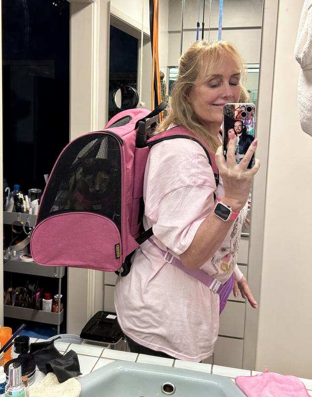 Mom carrying Xani in her new travel backpack