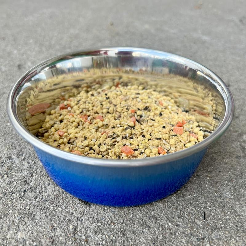Blue bowl of Hari Tropimix Canary & Finch Bird Food