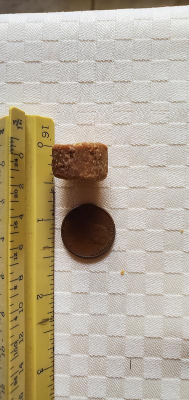 Width of a penny, almost a half inch thick