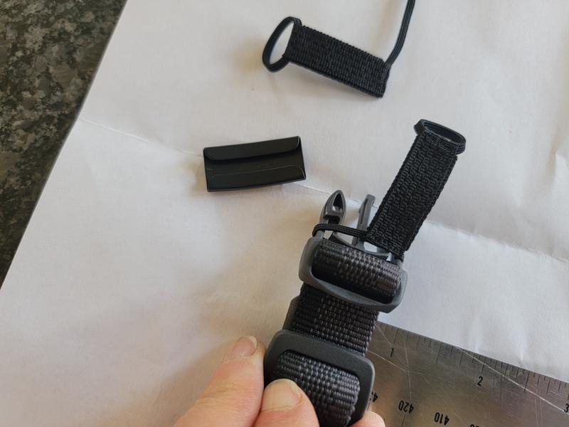 Show how tight the elastic is stretched, but it won't fit over the buckle.