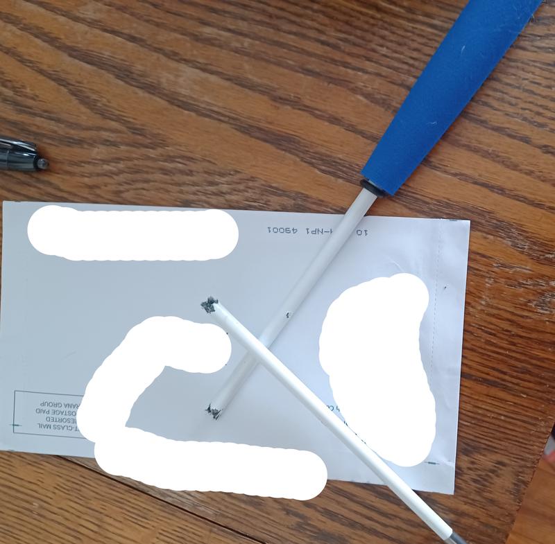 A wide shot of the chewed ends of the toy.