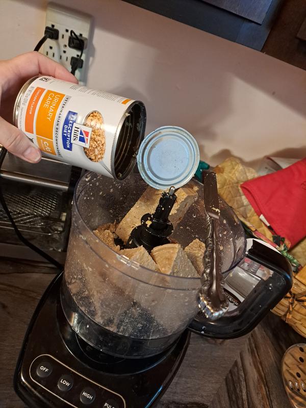 Run canned food through food processor