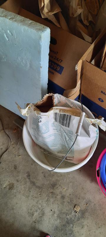 I put the bag upside-down in a bucket to prevent more spillage.