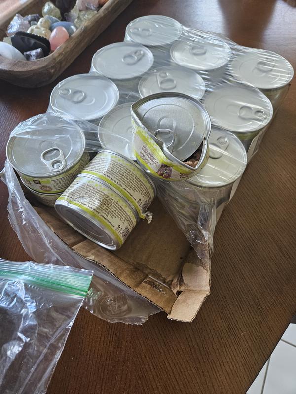 1 can open, 5 dented and goo all over