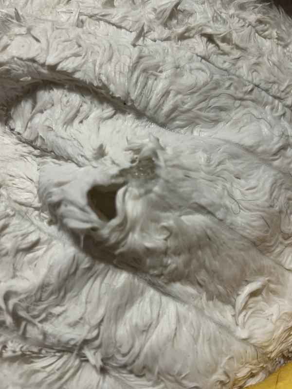 Hole on bottom of duck. Pulled out stuffing. Continued to make larger.