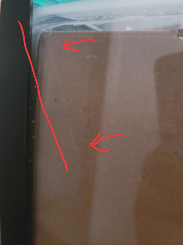 Looked cracked, but it was stray glue. The other sides had it too.