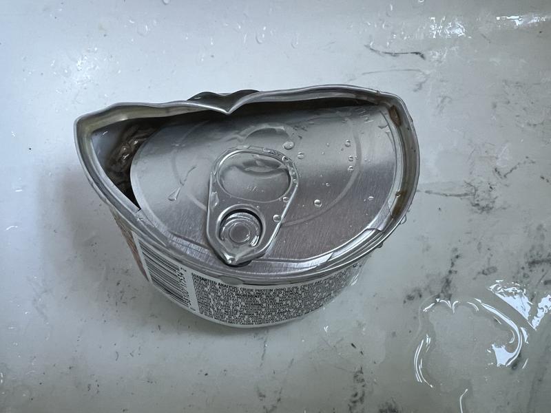 Damaged can out of box.