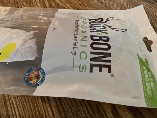 Package with yellow sticker, crumbled bag