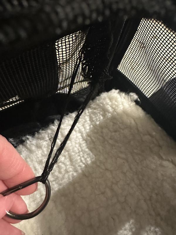 Metal ring hanging by a thread
