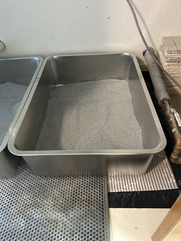 Keeps the litter pans from moving.