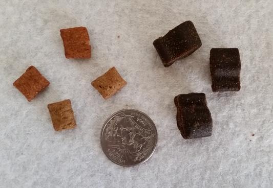 For size comparison: temptations on left and american quarter in middle. The treats are very dense and square, so they're just as wide as they are tall whereas the temptations are very thin.