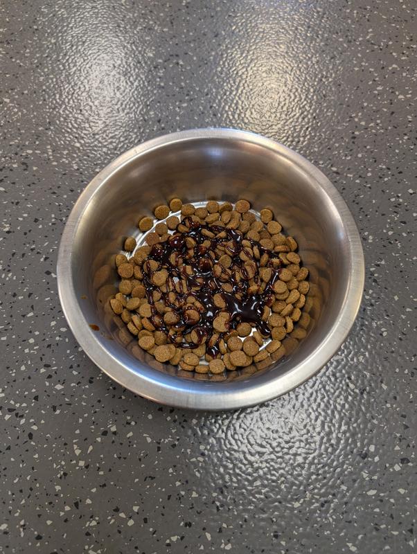 Applied directly to the kibble via spoon - evenly coats the pieces for easy use