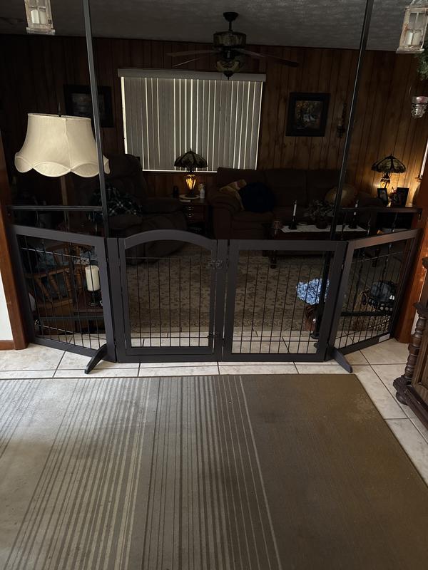 At the right far down corner and left corner is where I had to put bungy cords to keep my dog from escaping plus keeps the gate sturdy.