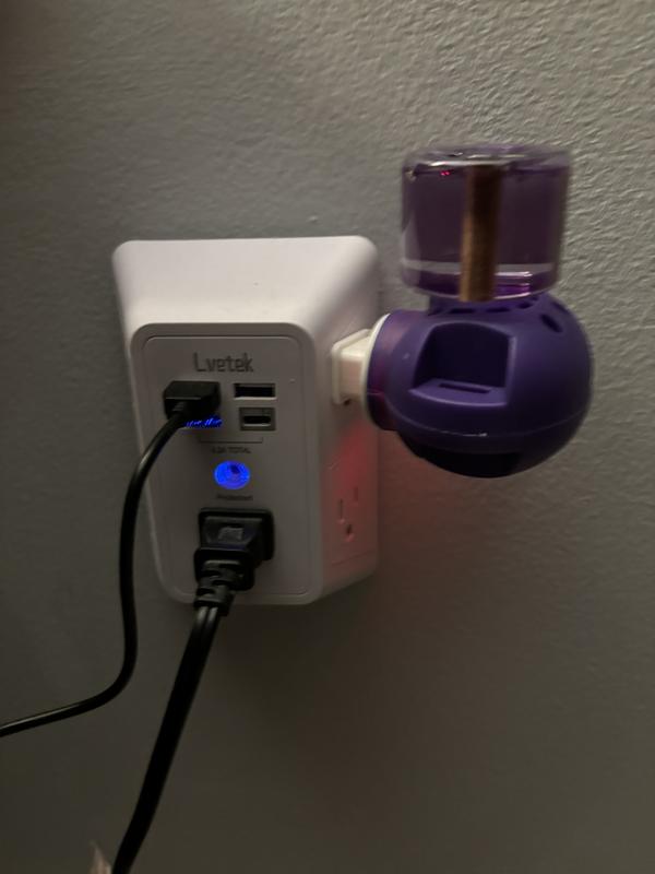 Base and diffuser refill plugged into outlet. Base not included with refills.