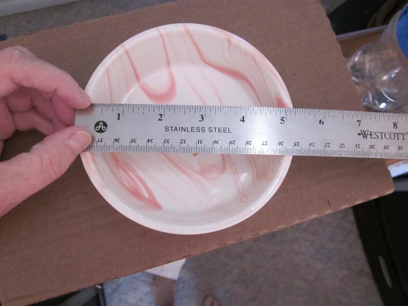 Wider than the 4.88inches stated on listing, looks more like 5 1/4"