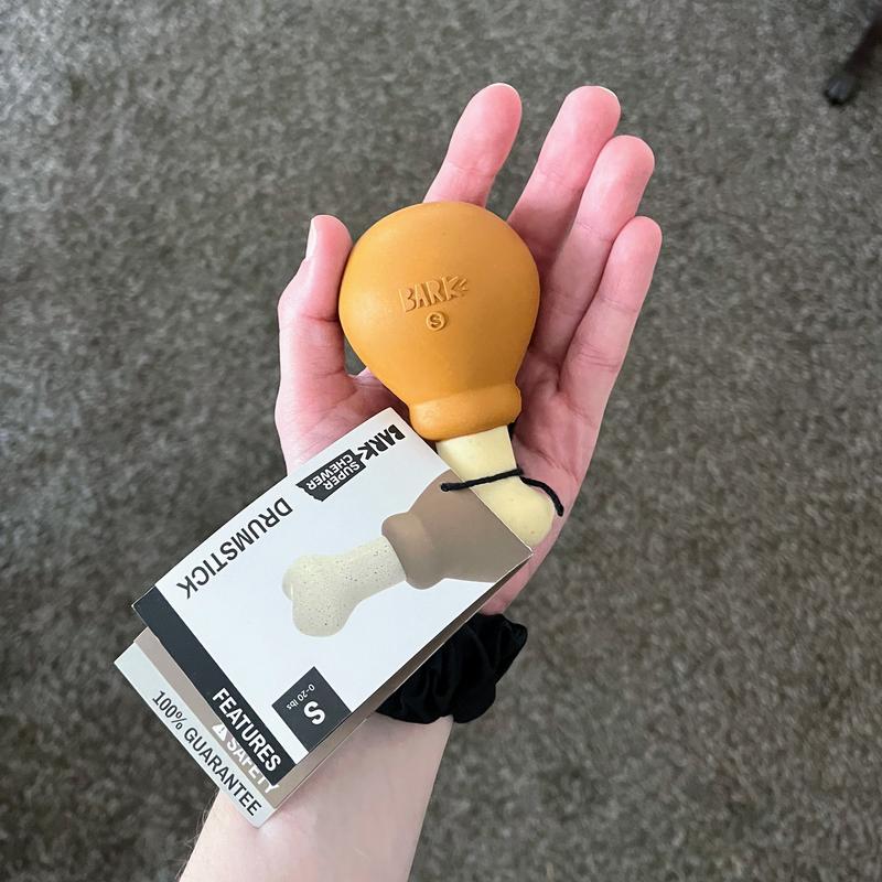 Holding the toy in my hand to show the size