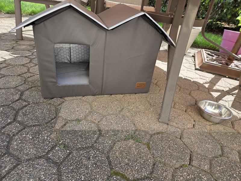 Unheated outdoor multi cat house under an outddor table.