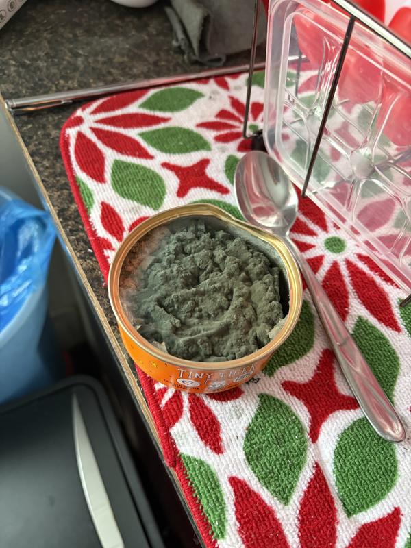 Dented can w/green food