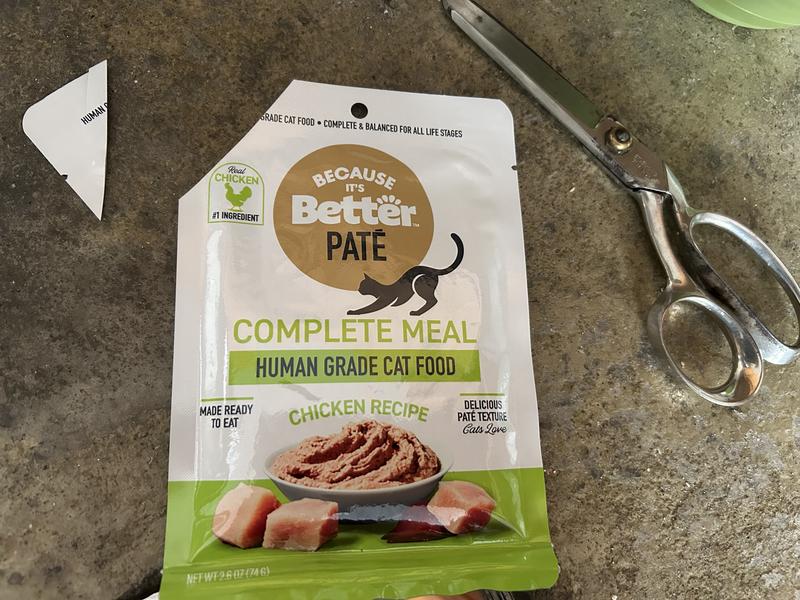 I cut one corner off and squeeze it out, less messy than tearing the whole top off