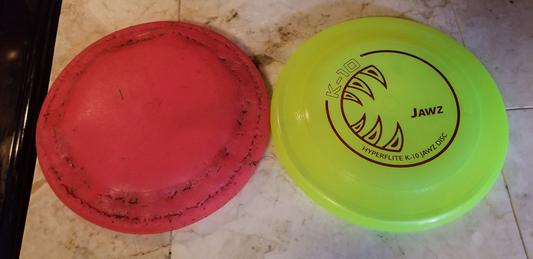Pink frisbee on the left has been used for 10 months - it still flies great!