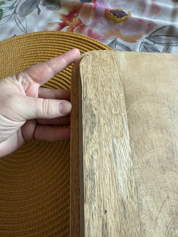 Wavy cut instead of a straight line on lid leading to improper seal- poor workmanship