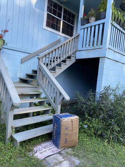 Not on porch. Left at bottom of steps.