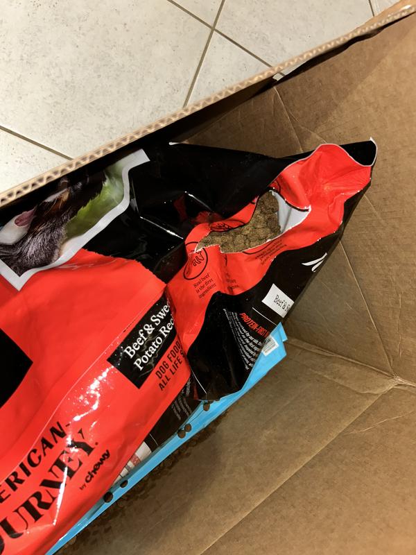 Torn packaging inside box.