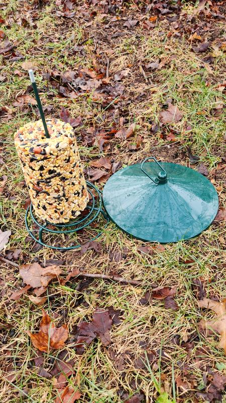 The seed log refills simply slide onto the post, and the roof screws on the top