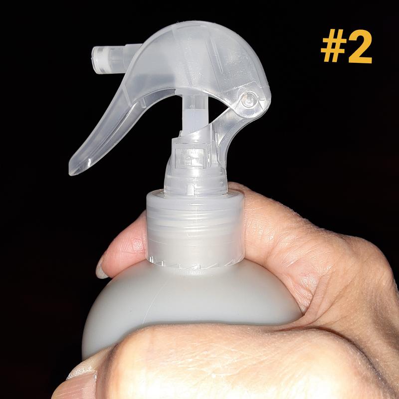 No narrowing of bottle to easily hold on to while using spray