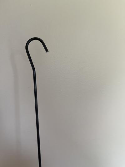 a hook that keeps the panels in place. It is sharp and is eye level with my dog