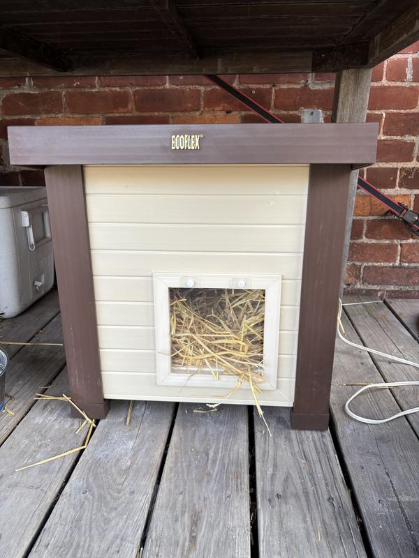 Assembled house with straw bedding and a pet-safe heating pad added.