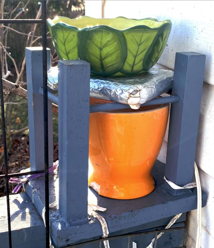 Winter water bowl with coffee cup warmer wrapped in metallic tape.