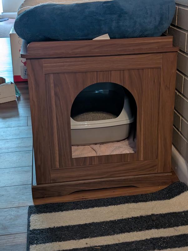 towel underneath litter box to try and make my cats more comfortable with it
